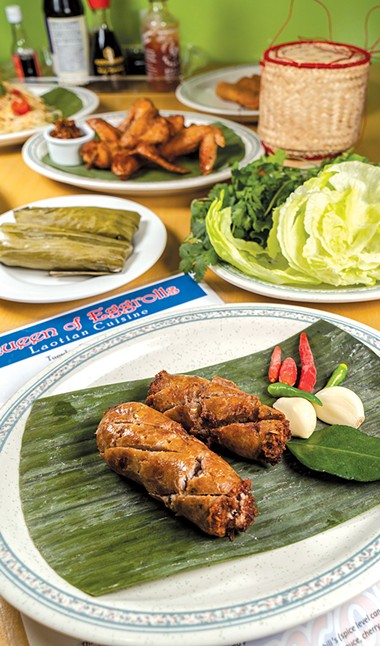Lao sausage is pork mixed with garlic, lemongrass and other flavors before being stuffed in casings and deep-fried. - PHILLIP DANNER