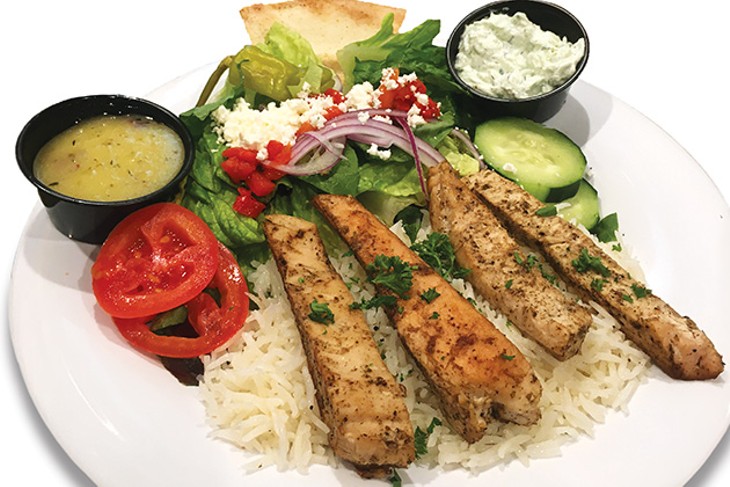 A chicken feast meal with basmati rice from Taziki’s Mediterranean Cafe - JACOB THREADGILL