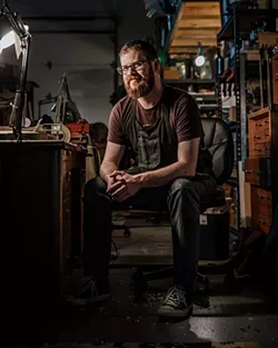 Arsenios Corbishley makes violins, violas and cellos in his shop in Farmers Market District. - NEISHA T. FORD