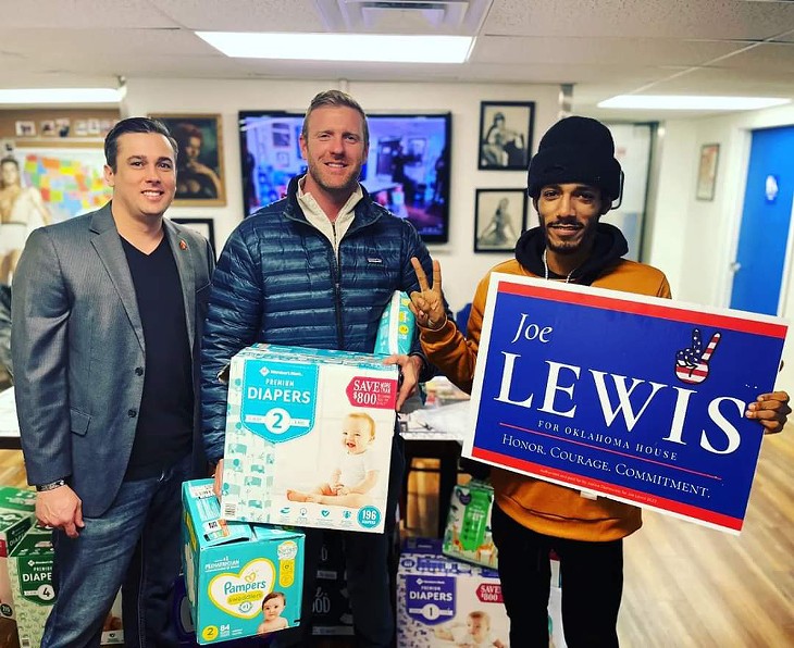 Lewis (left) at the Diapers for Dads event. - PHOTO PROVIDED