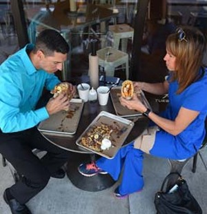 Michael & Jennifer Bucking Ham get inot their food at Waffle Champion.  mh