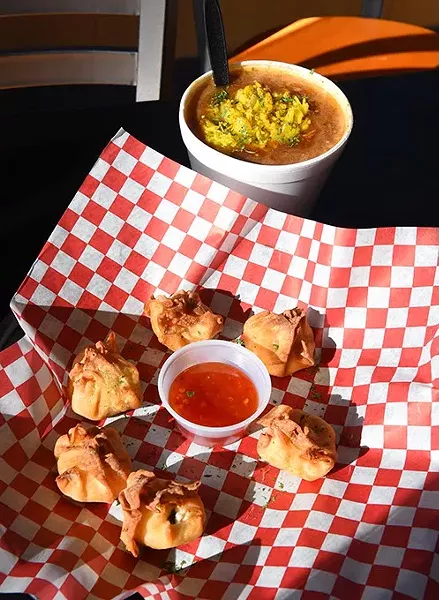 Crispy seafood wontons and a bowl of gumbo at Off The Hook Seafood & More. (Mark Hancock)