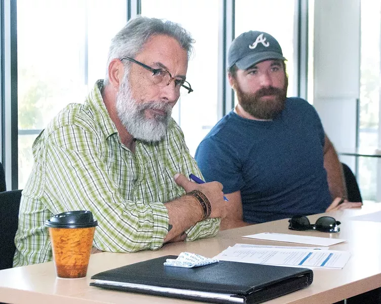 President of Sustainable OKC and UCO sustainability coordinator, Tim Tillman and board member Brandon Tyler during a SOKC board meeting at the Myriad Botanical Gardens confrence room in OKC. - PHOTO/LAUREN HAMILTON