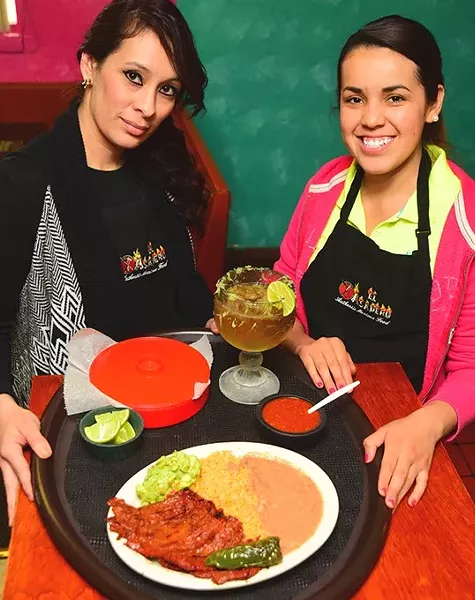 Left, Cesilia Marquez, and Maria Dolores, with Carne Asada, beans, rice, and beer, at El Asadero. mh