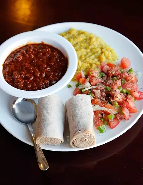 Yemsir Wot with Msir Kik and Kachumbari at Haiget's Restaurant in Edmond, Thursday, April 30, 2015. - GARETT FISBECK