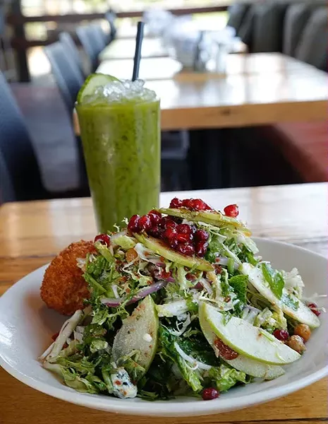 Kale and pomegranate salad and Popeye fresh juice at Whiskey Cake in Oklahoma City, Thursday, June 4, 2015. - GARETT FISBECK
