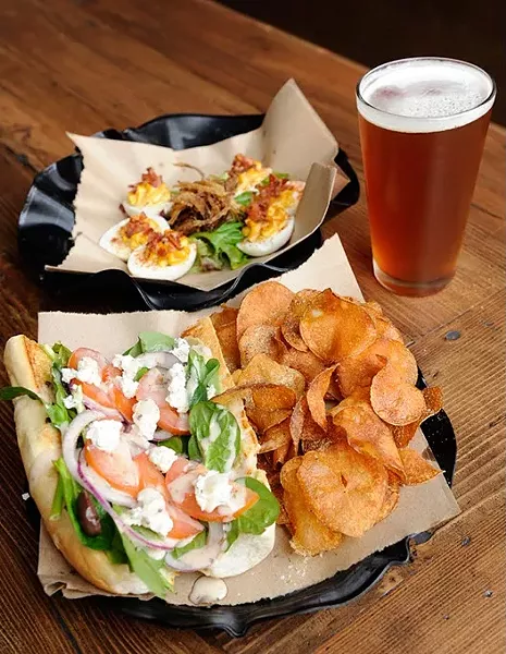 Santorini Sandwich with kettle chips, deviled eggs, and Roughtail IPA at Slaughter's Hall in Oklahoma City, Wednesday, Jan. 28, 2015. - GARETT FISBECK
