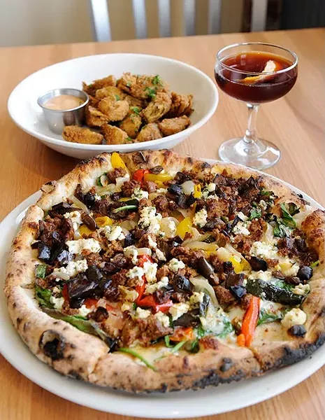 Lamb sausage pizza, fried artichoke hearts, and a Antiquato cocktail at Pizzeria Gusto in Oklahoma City, Wednesday, Jan. 28, 2015. - GARETT FISBECK