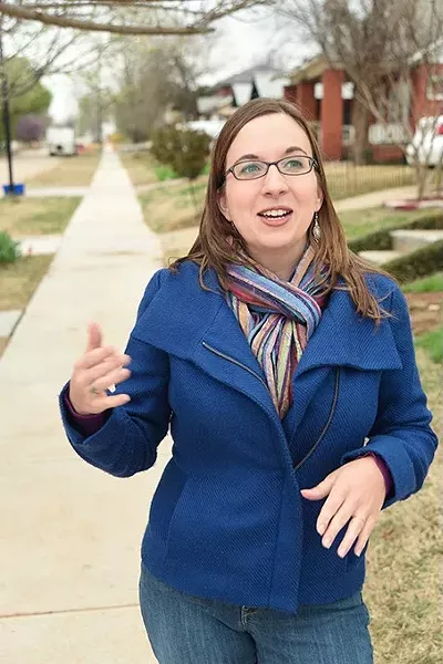 Classen's North Highland Park Neighborhood leader, Liz Stevens, on recently constructed sidewalks. mh