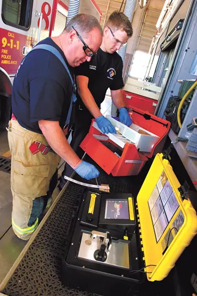 HAZ MAT firefighters left, TJ Thomson and Brent Bloyed test a Hazmat ID system at Station 5. Photo/Shannon Cornman - SHANNON CORNMAN