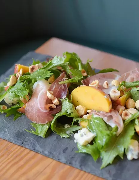 Local peach salad at Mary Eddy's Kitchen, Friday, July 28, 2017. - GARETT FISBECK