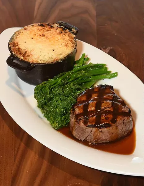 with potatoes, sauteed broccolini, and bone-marrow demiglace, at Flint. mh