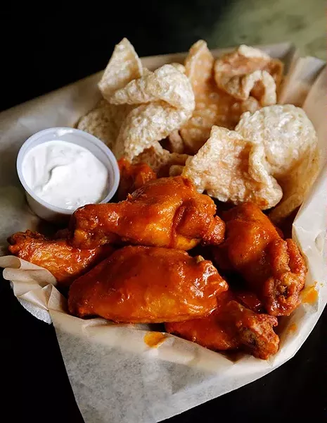 Sriracha hot wings and ghost pepper pork rinds at Knucks Wheelhouse in Oklahoma City, Friday, April 17, 2015. - GARETT FISBECK