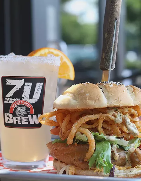 The Beer-Battered Bacon and Onion Burger with a Pink Zebra cocktail at The Zu in Edmond, Okla. (Cara Johnson).