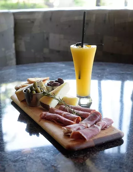 Salumi y formaggi and peach bellini at Bellini's Underground, Wednesday, Aug. 31, 2016. - GARETT FISBECK
