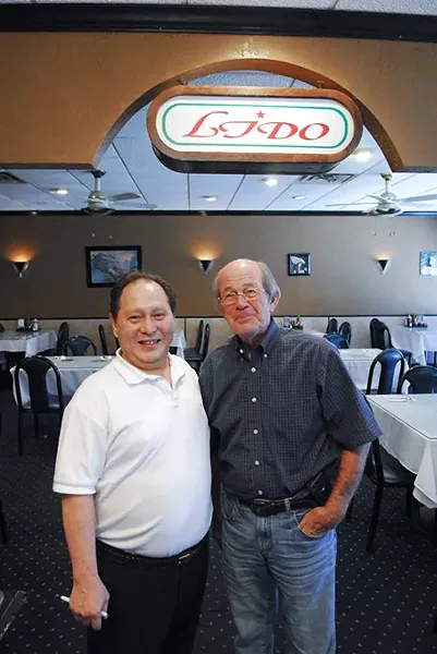 Paul Ly and one of their best customers, Phil Roberts. mh