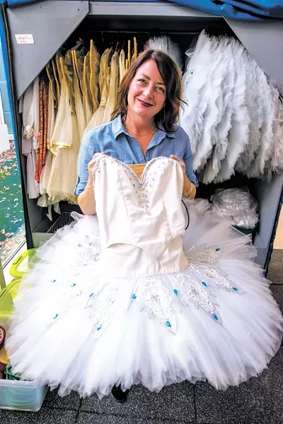 Dayna Brown goes through the Snowflake tutus used in Oklahoma City Ballet’s The Nutcracker. | Photo Mark Hancock