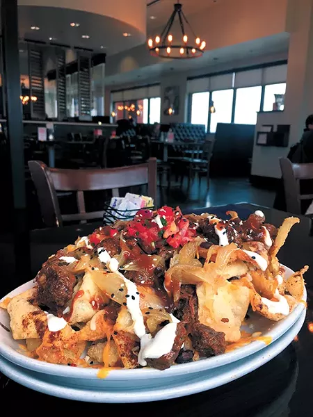 Using wonton chips and Korean-inspired skirt steak, fusion nachos are El Toro Chino’s most popular dish. | Photo Jacob Threadgill