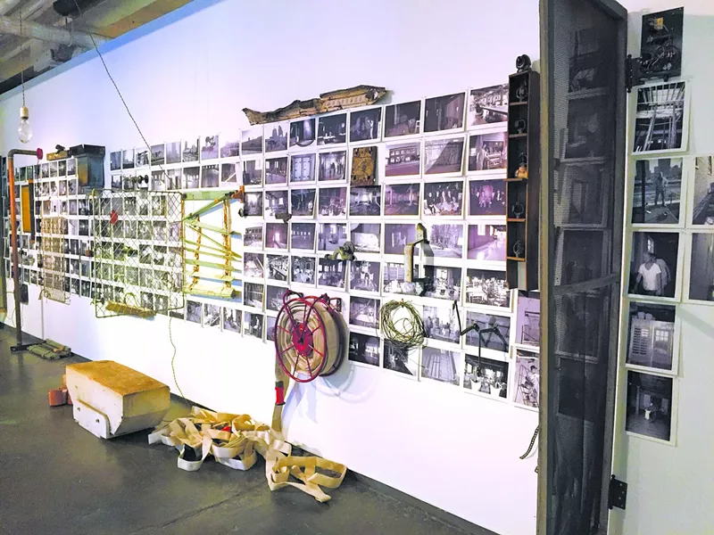 The Reclamation Re-Creation installation combines historic photos with artifacts from the building's history. | Photo Ben Luschen