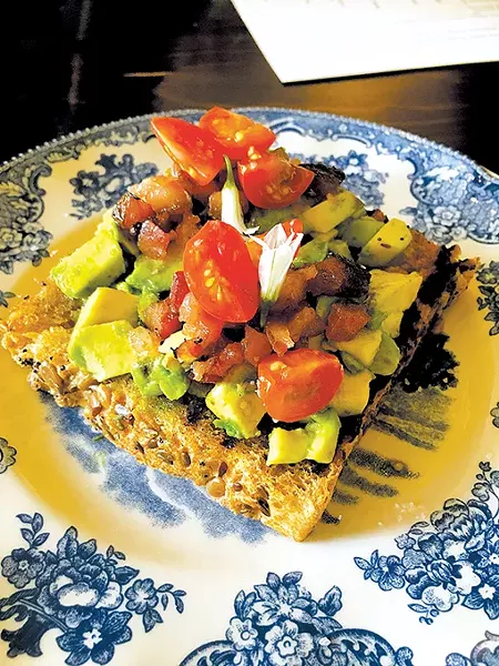 The avocado toast is a new item with maple bacon, cherry tomato and white truffle oil. - JACOB THREADGILL