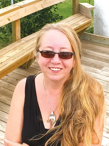 Jessica Petrus won Hideaway’s inaugural collage contest in 1999 and became the restaurant’s main artist, creating its signature collages at 18 locations. - JACOB THREADGILL