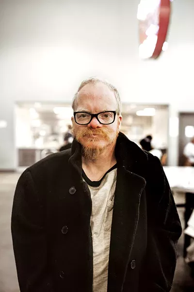 Forty-year-old Darrell Smith poses with his favorite winter coat at The Homeless Alliance of Oklahoma City. - ALEXA ACE
