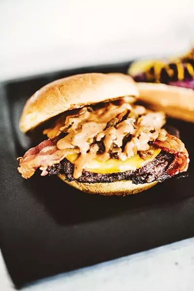Burgertopia now offers a smoked Gouda burger that featuring Gouda cheese, bacon, bourbon - onions and Theta sauce. - ALEXA ACE