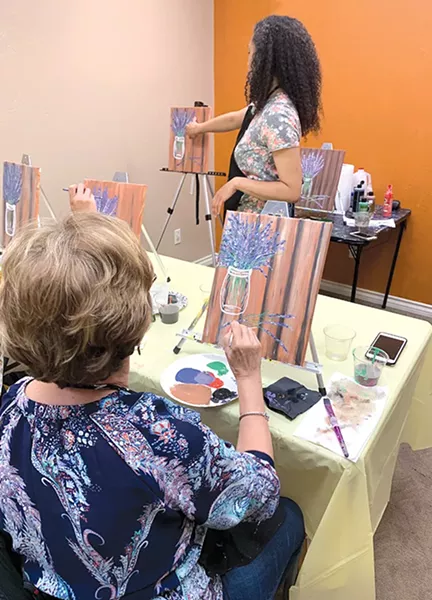 Erica Nkechi leads a paint party at her studios. - PROVIDED