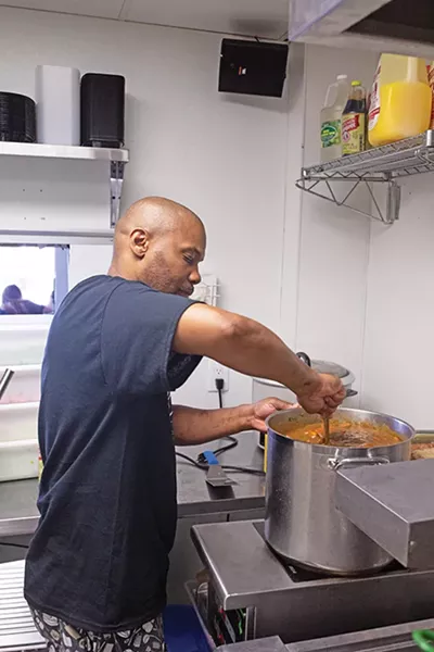 Dwayne Johnson stirs a pot of gumbo. - ALEXA ACE