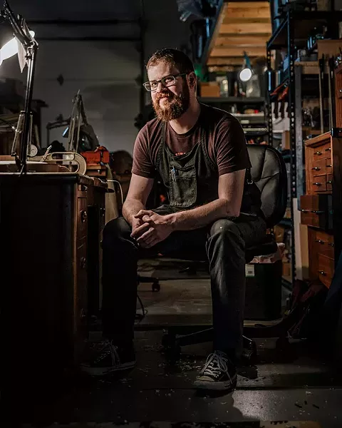 Arsenios Corbishley makes violins, violas and cellos in his shop in Farmers Market District. - NEISHA T. FORD
