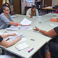 Women participants in the ReMerge program work at the non-profit's new facilities inside the building which houses Northcare, at 1140 N. Hudson Avenue.  mh