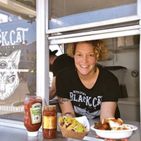 Beth Ann Lyon serves chipotle chicken tacos and the Clucker out of her new Black Cat Food Trailer in Delmar Gardens Food Truck Park.