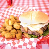 The French Brie Cheeseburger topped with crispy apples and a special sauce and a side of fried okra.