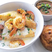 Shrimp with fried grits, a cup of gumbo and crawfish jalapeño cornbread at Magnolia Bistro
