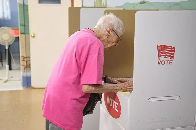 Elderly voter at Crown Heights Church of the Nazarene on 7-14-15. mh