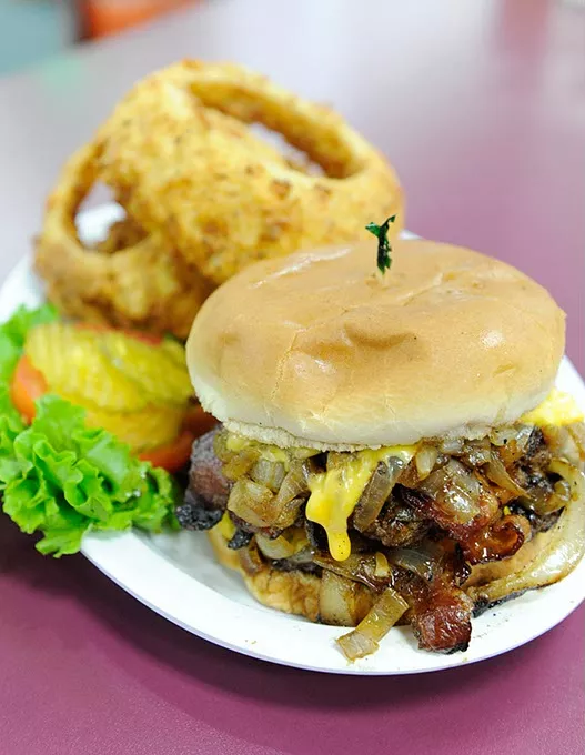Grilled Onion Cheeseburger and onion rings in Oklahoma City, Thursday, Nov. 12, 2015. - GARETT FISBECK