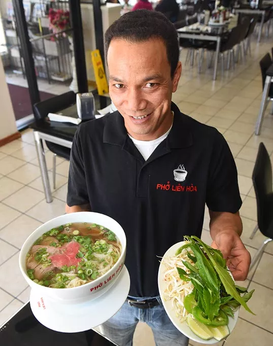Phong Nguyen with an extra large #P1 combo at Pho Lien Hoa. mh