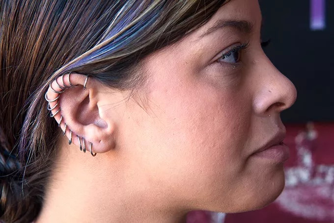 A ring of 16 gage continuous hoops worn by Ashley Primm at Hall of Tattoos on Main Street in Norman. mh