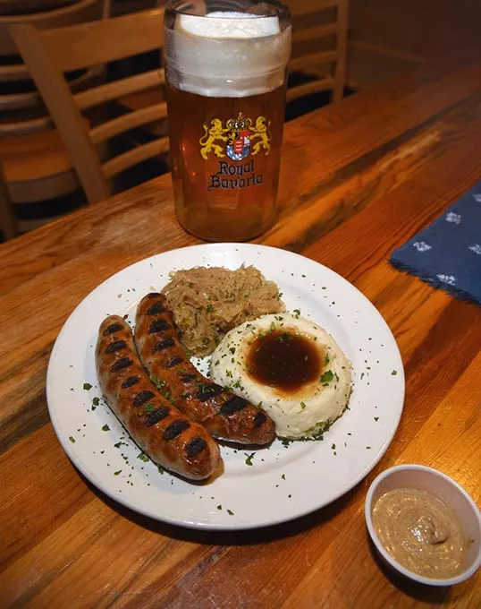 Stck.grobe Bratwurste mit Sauerkraut und Kartoffelbrei, with one of their house brews, at Royal Bavaria, 3401 S. Sooner Road in Moore, Oklahoma, 12-15-15. - MARK HANCOCK