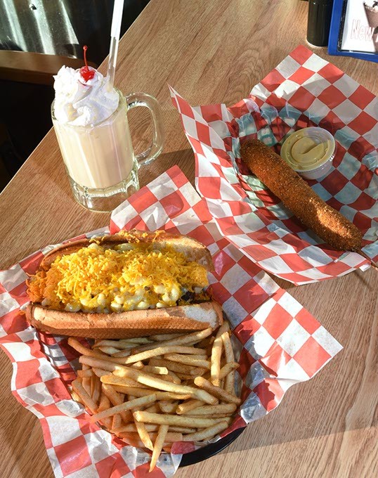 The All American featuring macaroni & cheese, with fries, next to The Wonderboy corn dog, and a vanilla shake, at Diamond Dawgs on Campus Corner in Norman, 12-12-16. - MARK HANCOCK