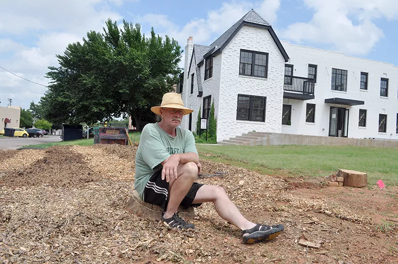 Ron Ferrell poses in front of the new 612 school, which will host artist from around the country to teach children and the community about nutrition and food, on Friday, June 27, 2014 in the Paseo District of Oklahoma City, Okla. - LAUREN HAMILTON