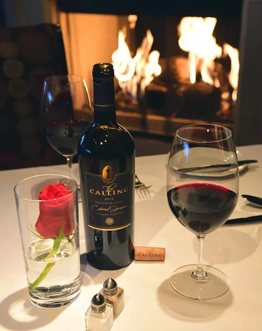 The Calling Cabernet Sauvignon by the fire at The Coach House, 6347 Avondale Drive.