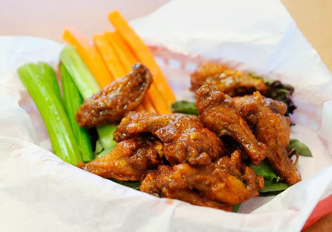 Hot wings in honey love sauce at Wing Supreme in Oklahoma City, Thursday, Jan. 28, 2016. - GARETT FISBECK