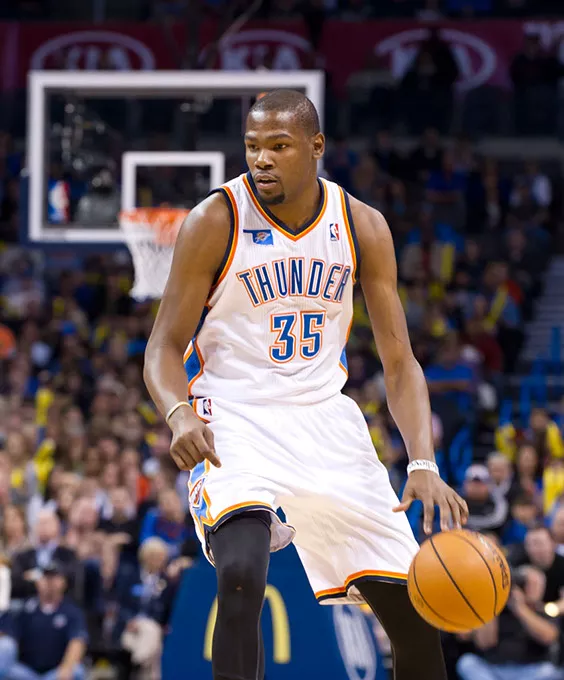 Kevin Durant sees an opening before scoring a basket against the Phoenix Suns in December duriing a home game.Photo/Shannon Cornman - SHANNON CORNMAN