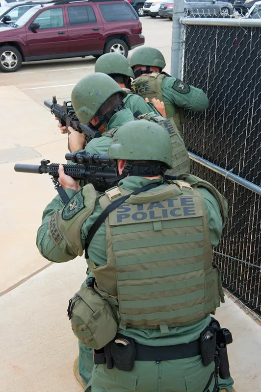 OBN State Police file in a raid postion.Photo/Shannon Cornman - Photo would be good for a cut out.