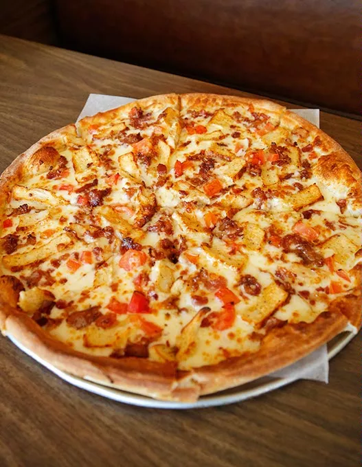 Moody's Alfredo Pizza at Pizzini's Pizza in Oklahoma City, Thursday, April 9, 2015. - GARETT FISBECK