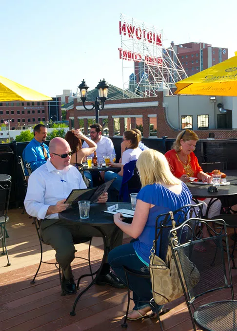 Patrons enjoy the outdoors with drinks and food on the rooftop at Cafe do Brasil.Photo/Shannon Cornman - SHANNON CORNMAN