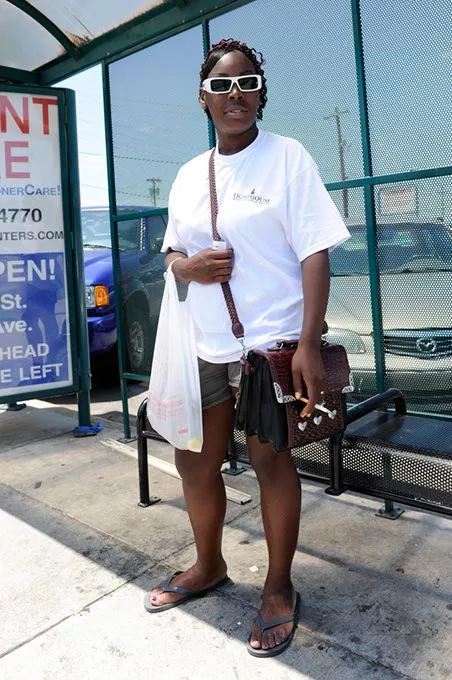Laquanna Tucker waits for a bus in Oklahoma City, Thursday, June 11, 2015. - GARETT FISBECK