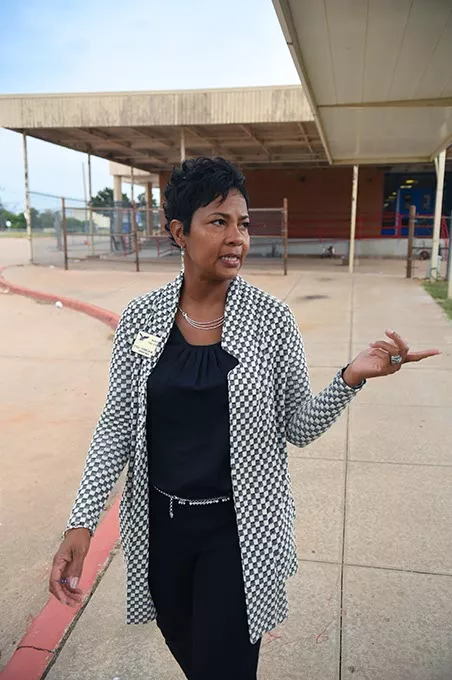 Millwood Public Schools Superintendent, Cecilia Robinson-Wood, points out a new playground while passing between the elementary and middle schools, 10-5-15. - MARK HANCOCK