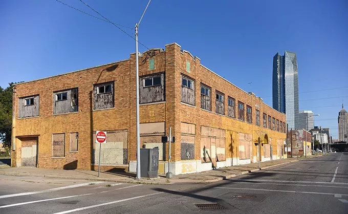 The Film Exchange Building, forground, located at the corner of S.W. 5th Street, along with the old City Rescue Mission building beyond, both along Robinson Avenue, are slated for demolition to make way for the new MAPS 3 Park, 10-14-15. - MARK HANCOCK